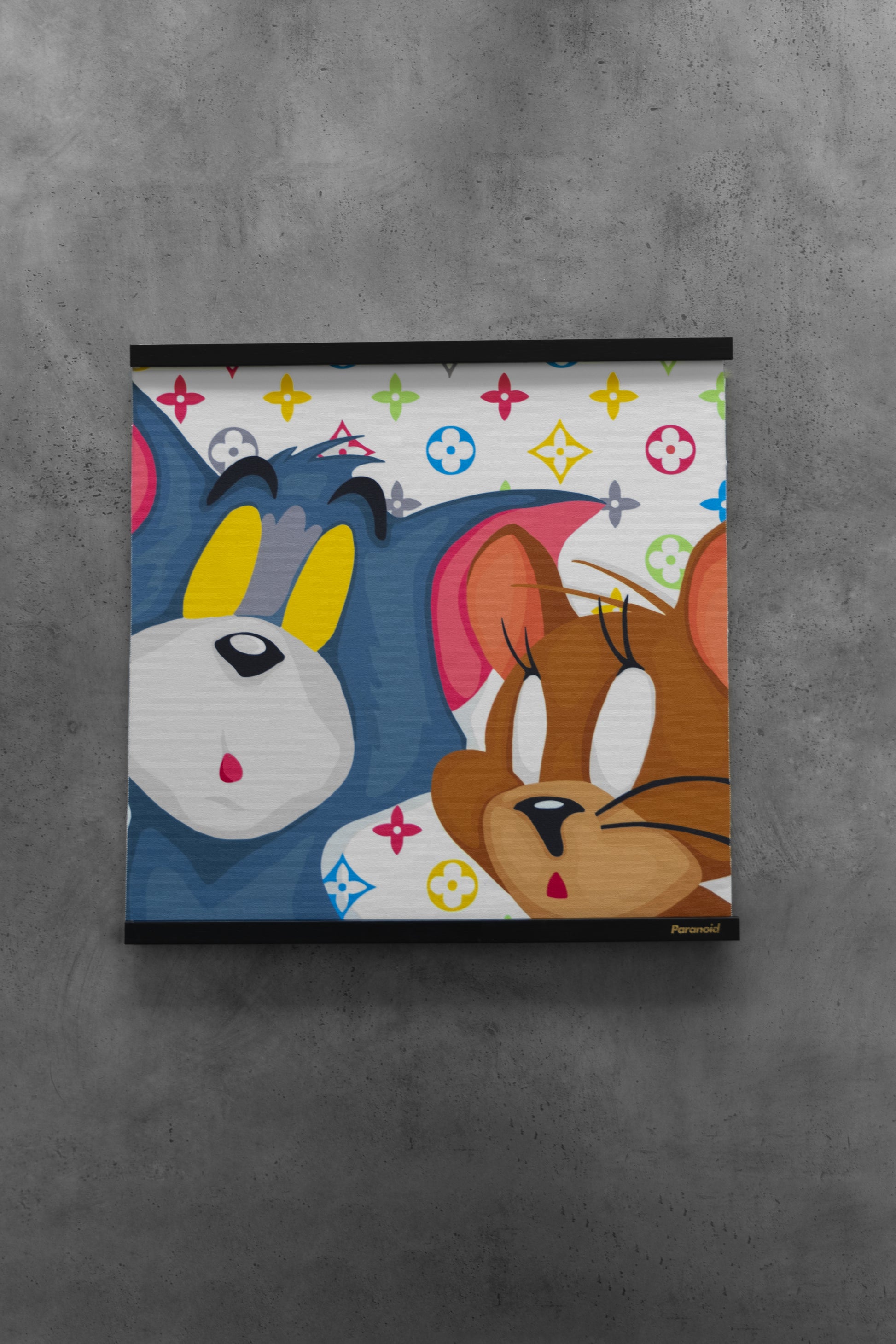 Framed artwork of cartoon characters on a gray wall

